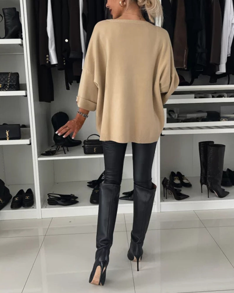 CLAIRE – ELEGANTE RELAXTE TRUI MET KNOOPMANCHETTEN