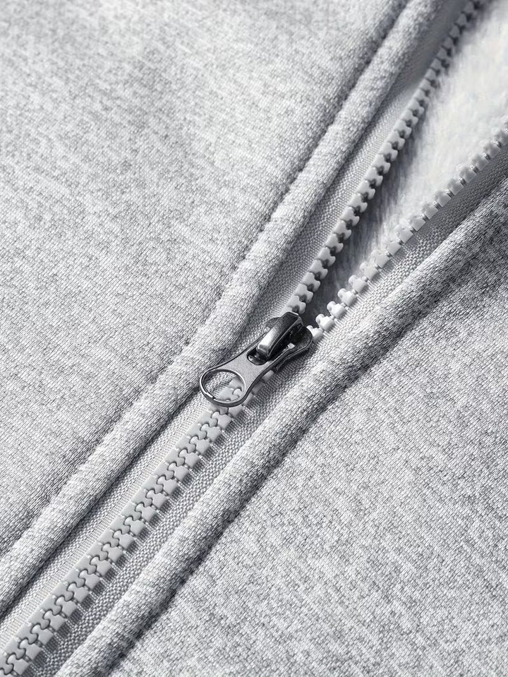 Fleece jas met capuchon en ritssluiting