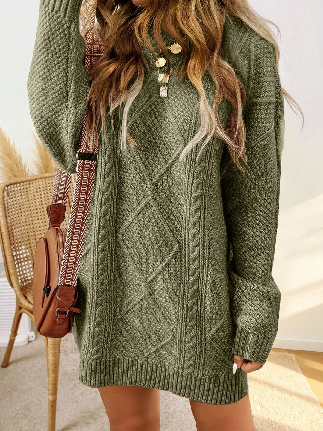 Trui jurk met kabelpatroon en ribbelafwerking