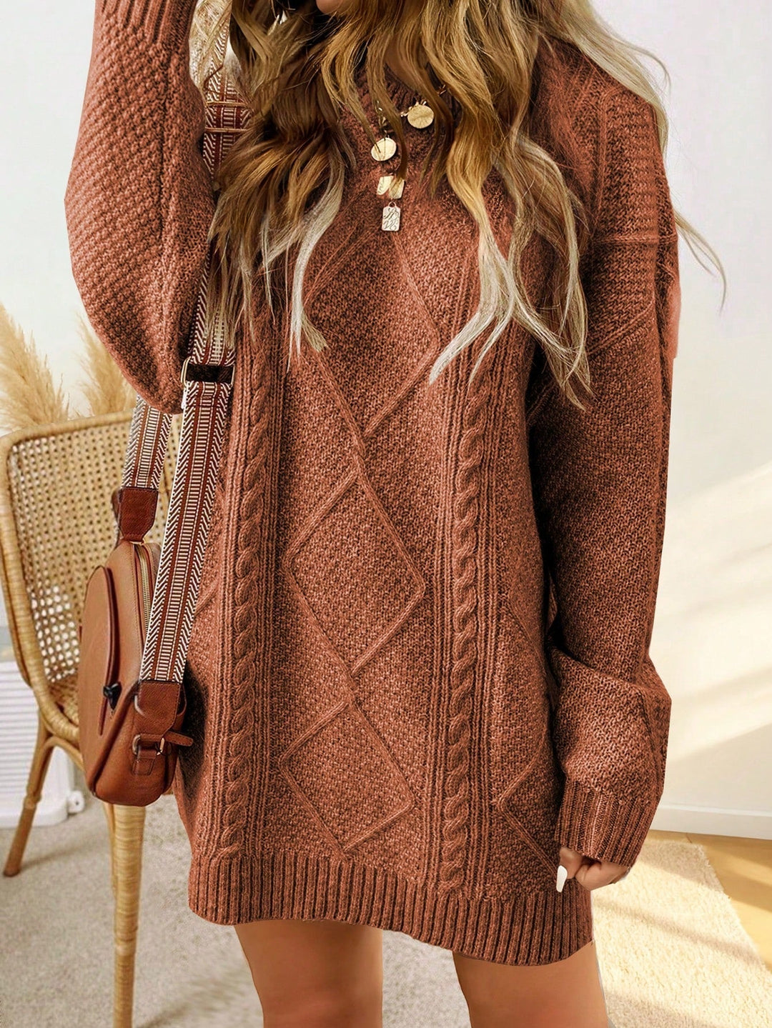 Trui jurk met kabelpatroon en ribbelafwerking